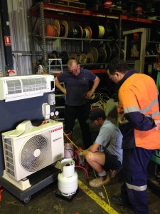 Teach watching a student training at our Perth split system course | Featured image for Air Conditioning Courses Perth & Electrical Courses Perth page on Get Skilled Training.