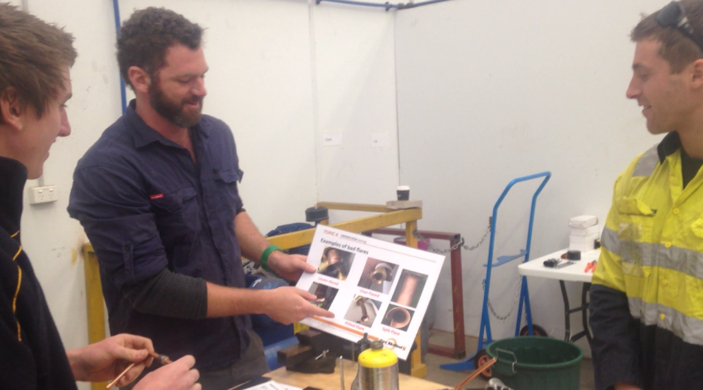 Trainers explaining flares to students in our Perth air conditioning course | Featured image for Air Conditioning Courses Perth & Electrical Courses Perth page on Get Skilled Training.