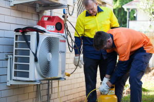 Two students training in person at our Brisbane air conditioning course | Featured image for Air Conditioning Courses Brisbane landing page.