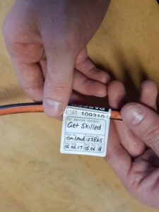 Phot of properly tagged electrical cord | Featured image for Test and Tag Training Course page for Get Skilled Training.