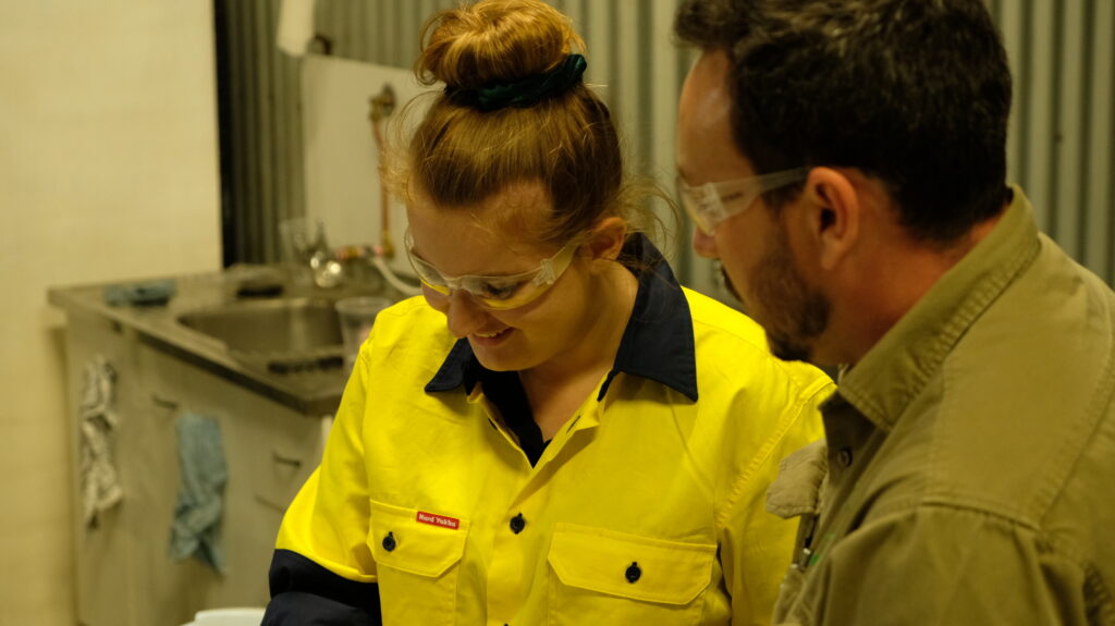 Man and woman smiling in workshop |