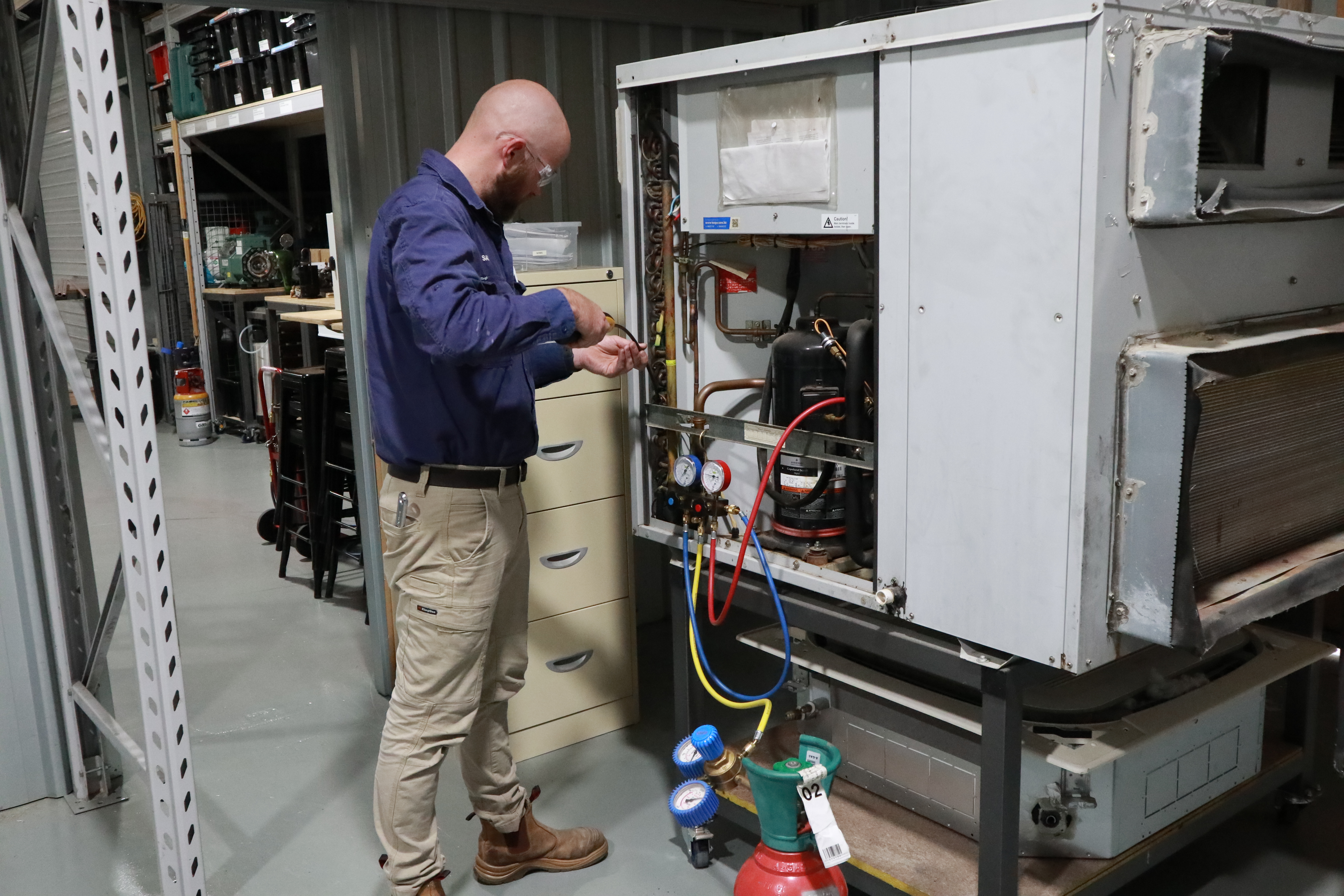 Man working with gas fittings.