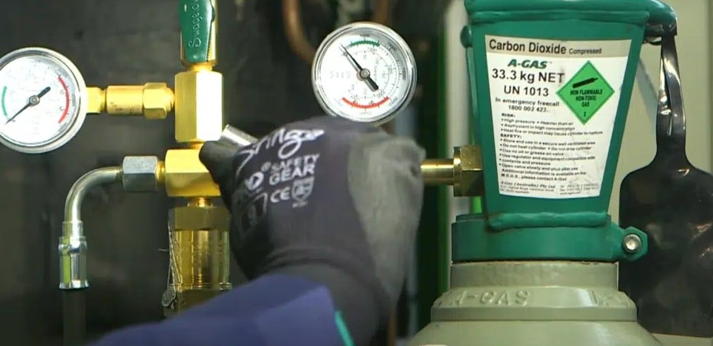 Hand adjusting carbon dioxide meter reading