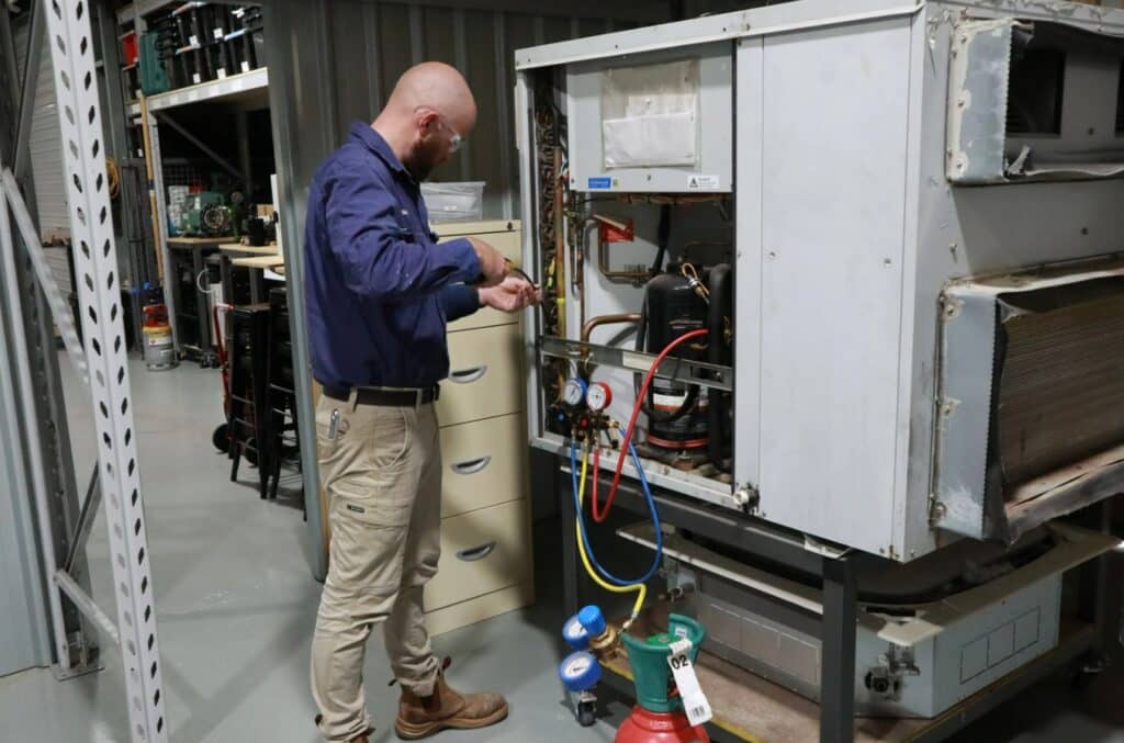 Man working with gas fittings.