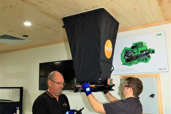 Two men taking airflow measurements | Featured image for Certificate III in Refrigeration & Air Conditioning on Get Skilled Training