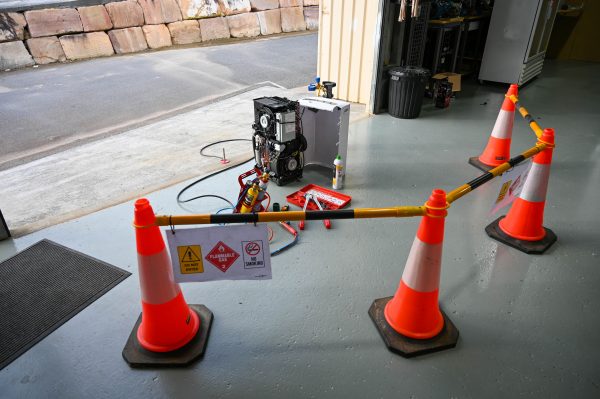 Gas work equipment behind safety barrier | Featured image for Gas Work License Hydrocarbon page on Get Skilled Training.