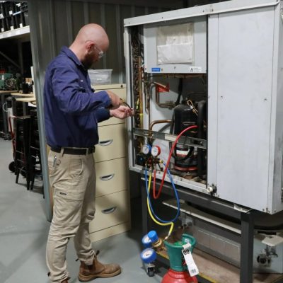 Man working with gas fittings.