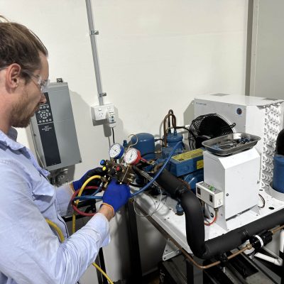 Man working on electrical equipment as part of refrigeration course
