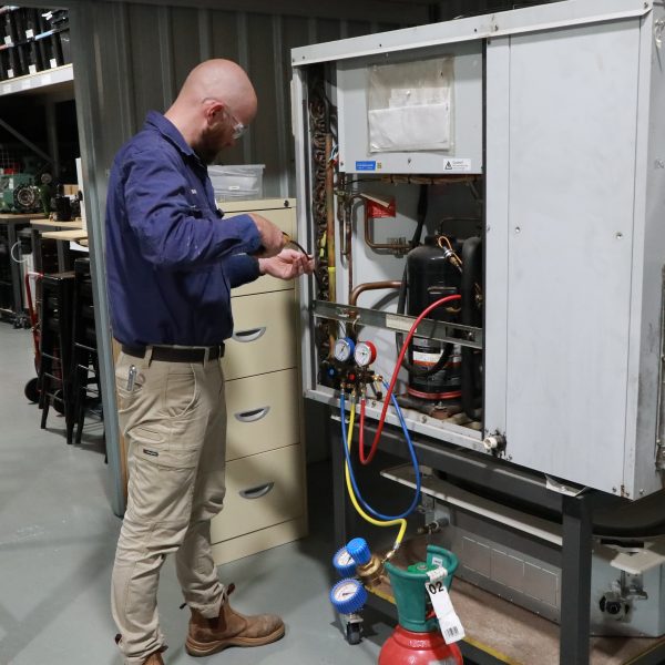 Man working with gas fittings.