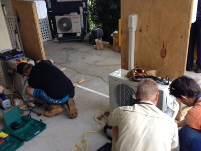 Students working on an air conditioner in our Melbourne split system course