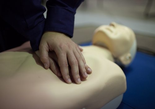 getskilled-263 CPR practise dummy being used | Featured image for Electrical Training Courses | Electrical RTO & Training for Electricians by Get Skilled Training.